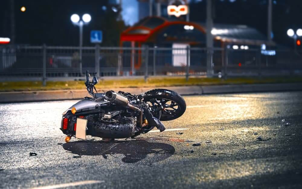 Motorcycle crash with bike down on the street