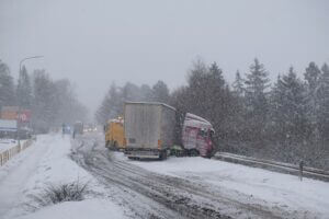 A truck jackknife on the road in snow weather