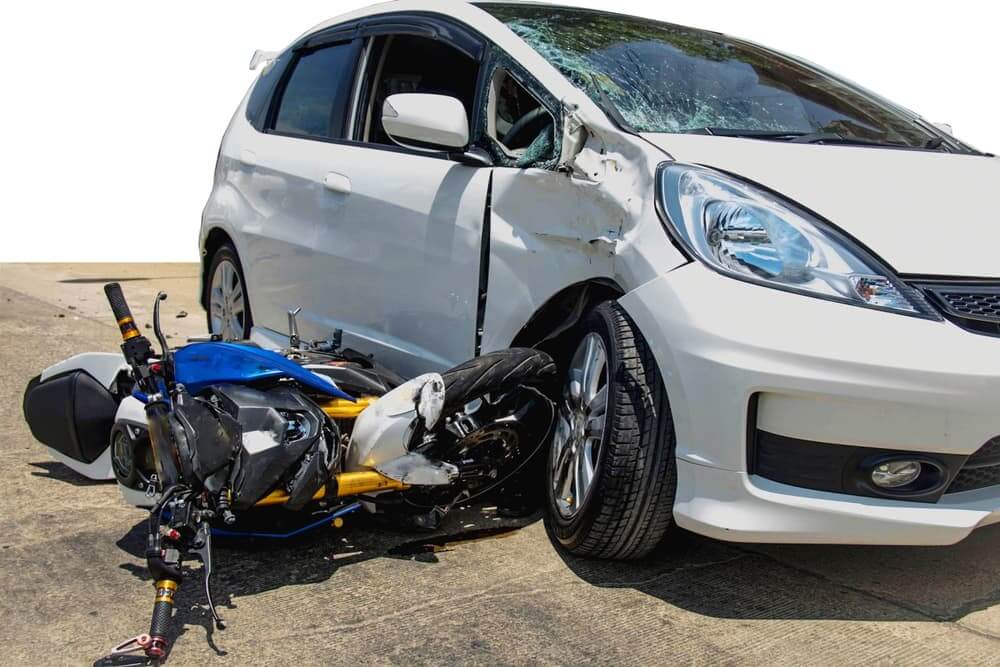 A collision between motorcycle and car