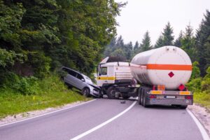 A truck collide with car due to wide turn