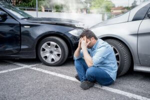 A man is in visible pain after being injured in a Lyft car crash.