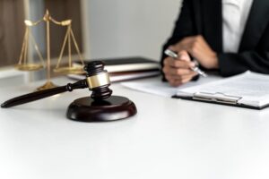 Lawyer handling a lawsuit in the courtroom, focusing on criminal law and the concept of justice. 