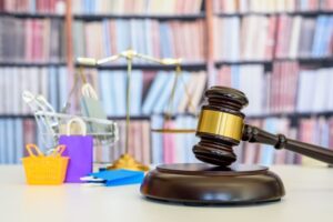 udge gavel, balance scale, bags, a shopping cart, depicting a safeguard designed to protect buyers from defective products