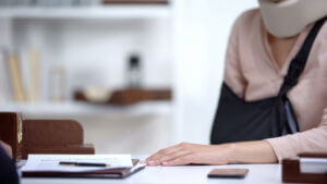Insurance agent informs injured victim of denied compensation, highlighting need to prove negligence in personal injury cases.