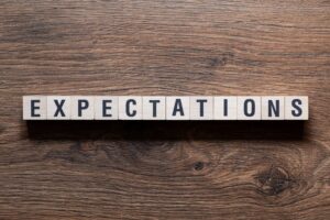 Expectations - word concept on building blocks, text